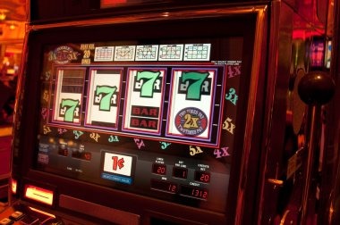 Reactoonz grid-based slot interface on kokang showing cascading symbols and character animations
